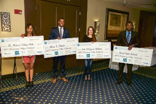 (l:r) Montgomery College students Meheret Solomon Hailu, Adrian K. Johnsto, Irina Valeryevna Koltsova & Daniel Kudzo Asiamah were awarded scholarship checks at the Gaithersburg-Germantown Chamber Annual Celebration Dinner in December. (Photo Credit: Phil Fabrizio, Sugarloaf Photography by Fabrizio)