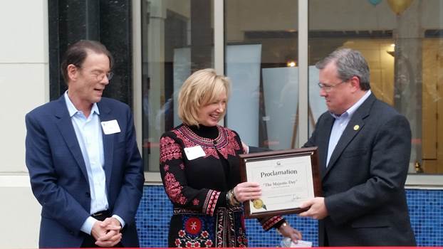 (r:l) City of Gaithersburg Mayor Jud Ashman presents Leigh Henry, Managing Member, HIP Projects and Pete Henry, Principal, Henry Investment Partners, LLC with a proclamation claiming November 1, 2016 “The Majestic Day” in the City of Gaithersburg Maryland at the Gaithersburg-Germantown Chamber conducted Ribbon Cutting Ceremony. (photo credit: Laura Rowles, GGCC Director of Events & Marketing)