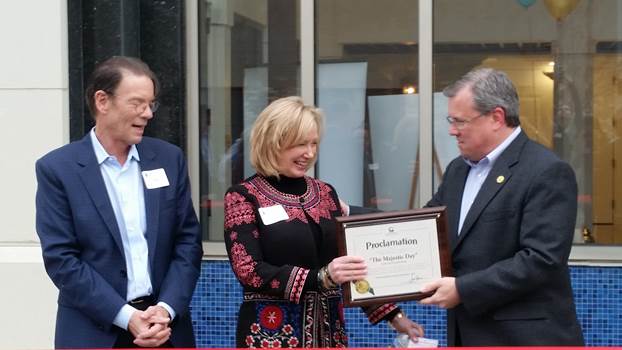 (r:l) City of Gaithersburg Mayor Jud Ashman presents Leigh Henry, Managing Member, HIP Projects and Pete Henry, Principal, Henry Investment Partners, LLC with a proclamation claiming November 1, 2016 “The Majestic Day” in the City of Gaithersburg Maryland at the Gaithersburg-Germantown Chamber conducted Ribbon Cutting Ceremony.   (photo credit: Laura Rowles, GGCC Director of Events & Marketing) 