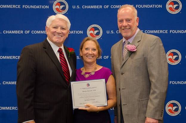 Steve Clark, Chair, Northeast Institute Board of Regents (left), Joseph Henning, IOM, Chair, Institute National Board of Trustees (right) recognizes Gaithersburg-Germantown Chamber of Commerce President & CEO, Marilyn Balcombe (center) as an Institute for Organization Management graduate. Institute for Organization Management is a professional development program of the U.S. Chamber of Commerce Foundation. The four-year program educates leaders on how to build stronger organizations, better serve their members and become strong business advocates. (photo credit: U.S. Chamber of Commerce Foundation)