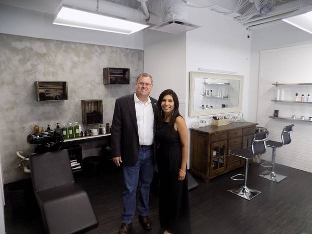 (r:l) Jud Ashman, Mayor, City of Gaithersburg and Suleka Perera, Owner & Gaithersburg Site Director, Symmetry Salon Studios Gaithersburg at Symmetry Salon Studios Gaithersburg ribbon cutting celebration. Perera brings 15-years of experience to Gaithersburg and is an International Cosmetologist, a Bridal hair and makeup artist, a salon owner, as well as an advanced educator. (photo credit: Laura Rowles, GGCC Director of Events & Marketing)