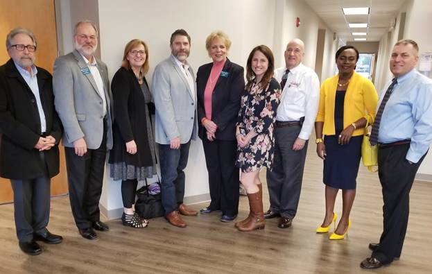 (l:r) Henry Bernstein, Scheer Partners; Jerry Therrien, Therrien Waddell, Inc.; Barbara Wilkinson, Community Pastor, Journey’s Crossing Church; Mark Wilkinson, Lead Pastor, Journey’s Crossing Church; Ellen Lambert, Baywood Hotels.; Brittany Hilton, Hughes Network Systems, Inc.; Bruce Kanner, Cartridge on Wheels.; AJ Nwoga, M&T Bank; and Doug Ryder, Holy Cross Germantown Hospital celebrate the grand opening of Germantown’s newest, non-denominational church, Journey’s Crossing. (photo credit: Laura Rowles, GGCC Director of Events & Marketing) 